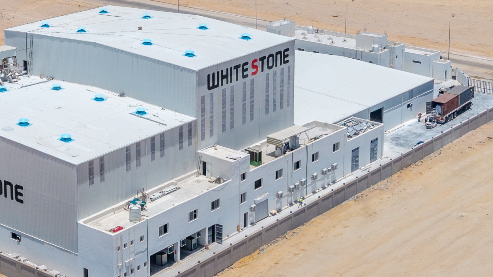 Container truck being loaded with palletized calcium carbonate at the White Stone warehouse