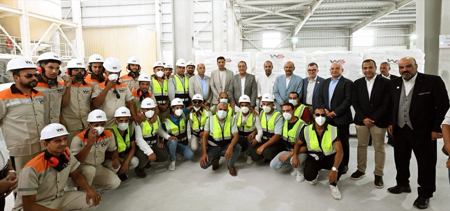 The Prime Minister of Egypt with officials and the full White Stone workforce in front of palletized product