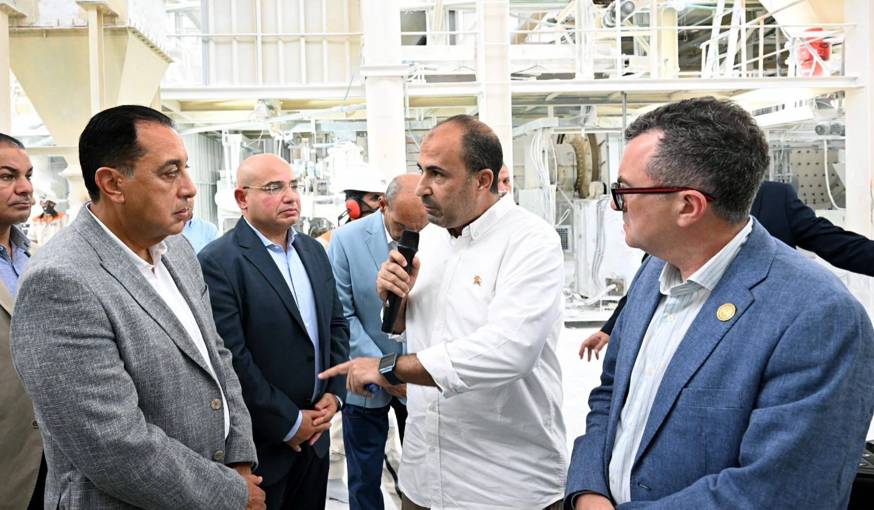 White Stone leadership briefing the Prime Minister inside the production hall